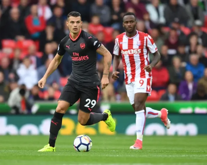 Framed Print : Xhaka Overpowers Berahino: Stoke City vs Arsenal, Premier League 2017-18 Framed Print : Xhaka Overpowers Berahino: Stoke City vs Arsenal, Premier League 2017-18