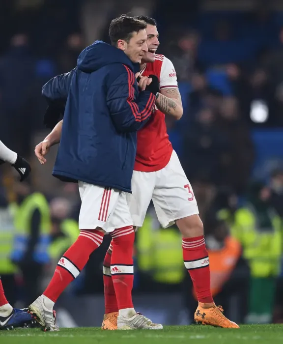 Framed Print : Xhaka and Ozil: Post-Match Moment at Stamford Bridge - Chelsea vs Arsenal, Premier League 2019-2020