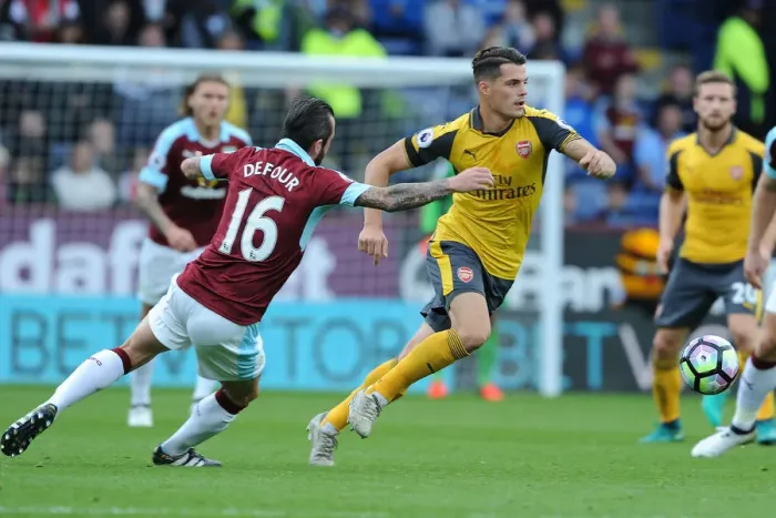 Framed Print : Xhaka Powers Past Defour: Burnley vs. Arsenal, Premier League 2016-17 Framed Print : Xhaka Powers Past Defour: Burnley vs. Arsenal, Premier League 2016-17