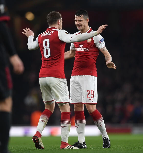 Xhaka and Ramsey Celebrate Arsenal's Europa League Goals Against AC Milan