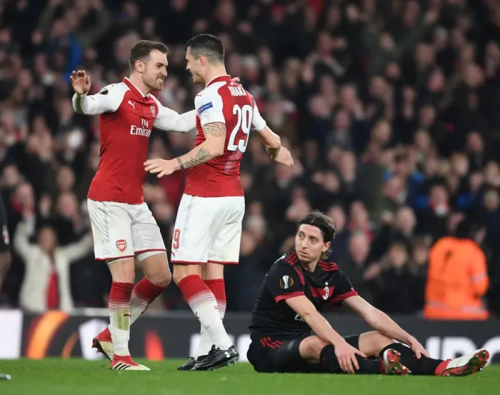 Framed Print : Xhaka and Ramsey Celebrate Arsenal's Goals Against AC Milan in Europa League Clash Framed Print : Xhaka and Ramsey Celebrate Arsenal's Goals Against AC Milan in Europa League Clash