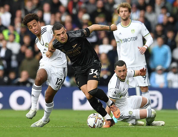 Xhaka Takes on Leeds Duo in Intense Arsenal-Leeds Clash (2022-23 Premier League)