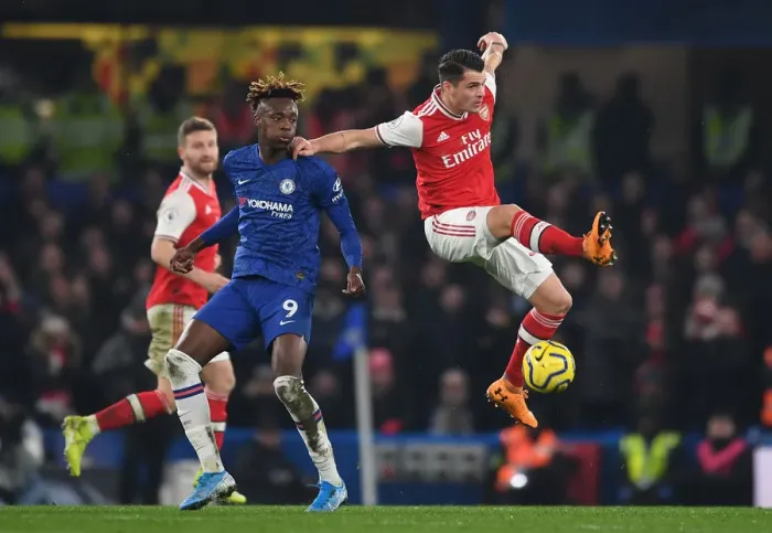 Framed Print : Xhaka vs Abraham: Intense Clash Between Chelsea and Arsenal in Premier League
