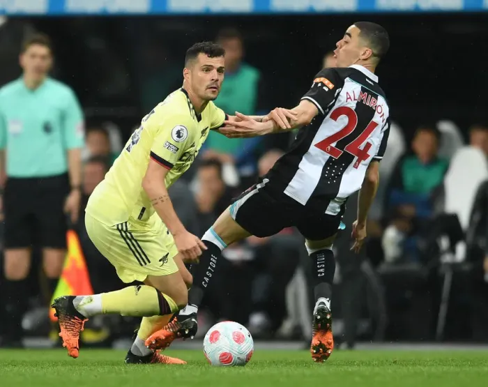 Framed Print : Xhaka vs Almiron: Intense Battle in Newcastle United vs Arsenal Premier League Clash