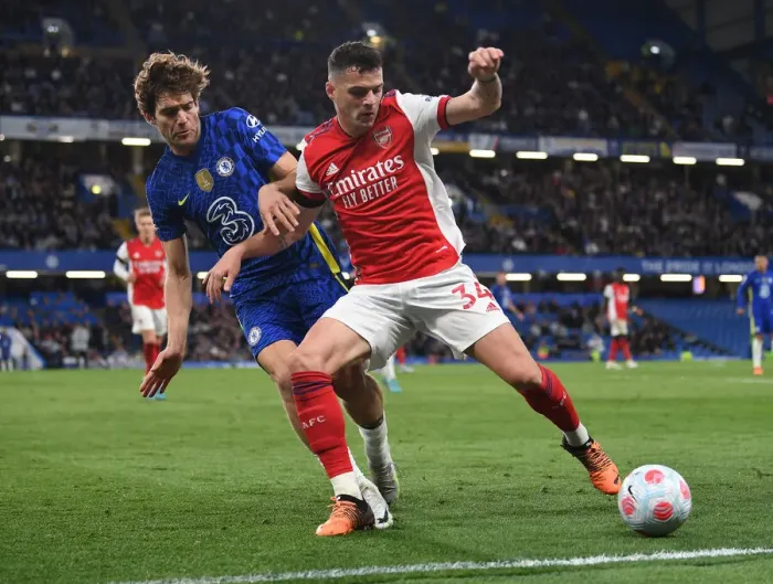 Framed Print : Xhaka vs. Alonso: A Premier League Battle at Stamford Bridge