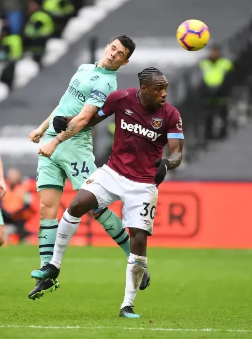 Framed Print : Xhaka vs Antonio: Intense Clash Between West Ham and Arsenal in Premier League