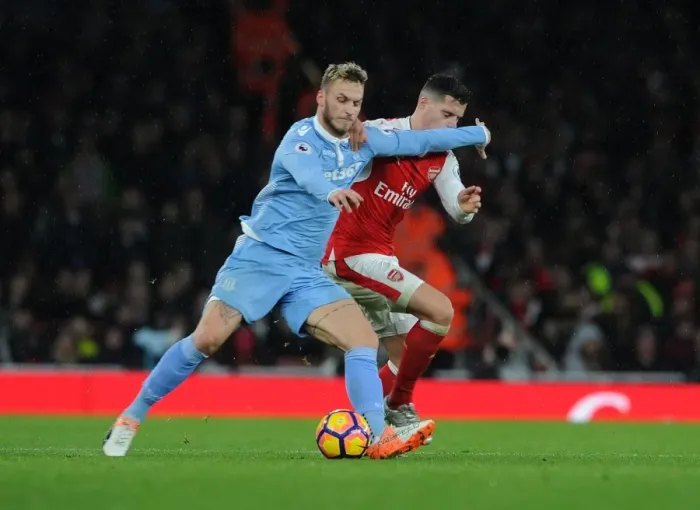 Framed Print : Xhaka vs Arnautovic: Battle for the Ball at Arsenal vs Stoke City (2016-17)