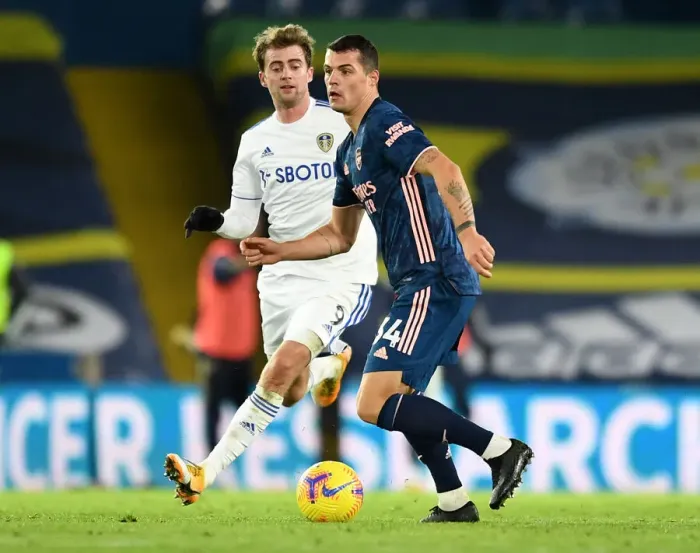 Framed Print : Xhaka vs Bamford: Intense Battle in Leeds United vs Arsenal Premier League Clash