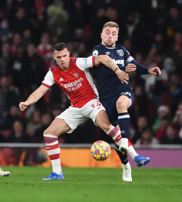 Framed Print : Xhaka vs. Bowen: A Premier League Battle - Arsenal vs. West Ham