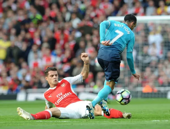 Framed Print : Xhaka vs Britton: Intense Tackle in Arsenal's Victory over Swansea City (2016-17)