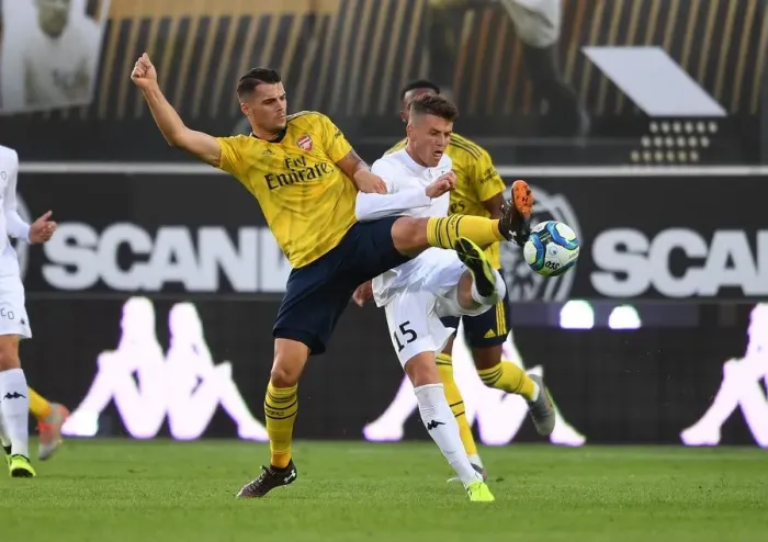 Framed Print : Xhaka vs Capelle: Clash in Angers - Arsenal's Pre-Season Battle