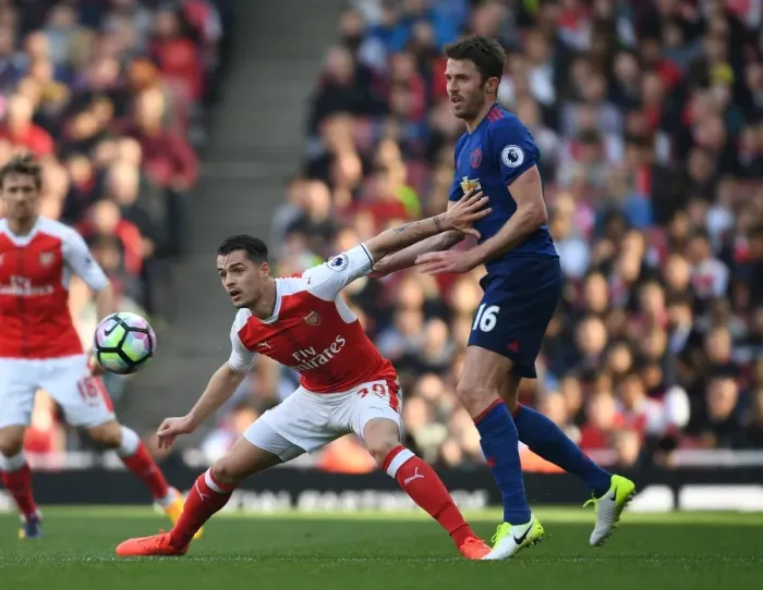 Framed Print : Xhaka vs Carrick: Intense Battle in Arsenal v Manchester United, Premier League 2016-17