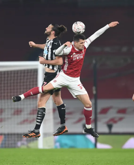 Framed Print : Xhaka vs. Carroll: Empty Emirates FA Cup Clash Framed Print : Xhaka vs. Carroll: Empty Emirates FA Cup Clash