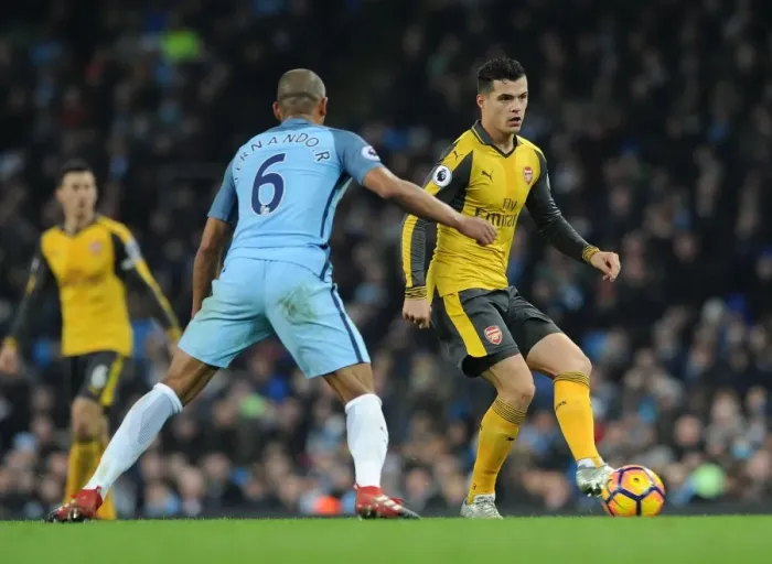 Framed Print : Xhaka vs. Fernandinho: Intense Battle in Manchester City vs. Arsenal Premier League Clash Framed Print : Xhaka vs. Fernandinho: Intense Battle in Manchester City vs. Arsenal Premier League Clash