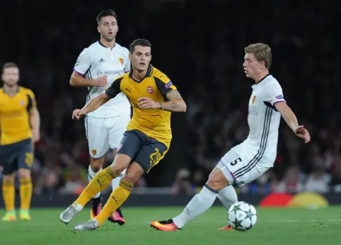 Framed Print : Xhaka vs. Fransson: A Battle for Ball Possession in Arsenal's UEFA Champions League Clash against FC Basel Framed Print : Xhaka vs. Fransson: A Battle for Ball Possession in Arsenal's UEFA Champions League Clash against FC Basel