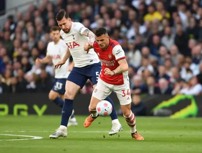 Framed Print : Xhaka vs Hojbjerg: Intense Battle in the Premier League Clash Between Tottenham and Arsenal (2021-22)