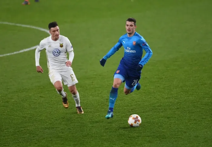 Framed Print : Xhaka vs Hopcutt: A Battle for Midfield Supremacy in Arsenal's Europa League Clash against Östersunds FK