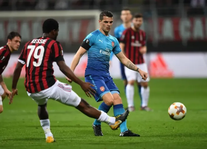 Framed Print : Xhaka vs. Kessie: Battle in the Midfield - AC Milan vs. Arsenal, UEFA Europa League