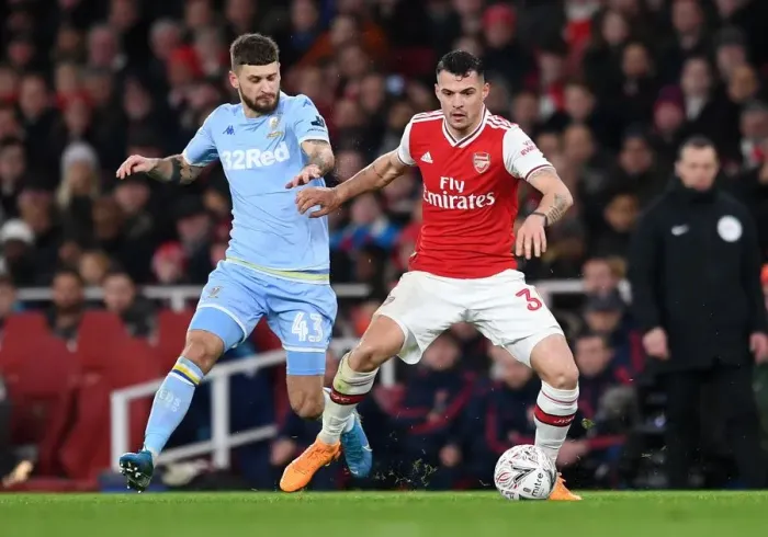 Framed Print : Xhaka vs Klich: A Midfield Battle in Arsenal's FA Cup Clash against Leeds United