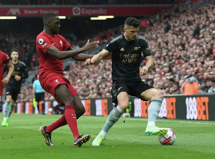 Framed Print : Xhaka vs Konate: A Premier League Battle at Anfield (2022-23) Framed Print : Xhaka vs Konate: A Premier League Battle at Anfield (2022-23)