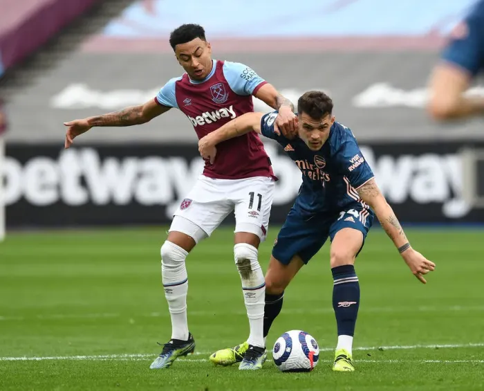 Framed Print : Xhaka vs Lingard: Intense Battle in West Ham United vs Arsenal Premier League Clash Framed Print : Xhaka vs Lingard: Intense Battle in West Ham United vs Arsenal Premier League Clash