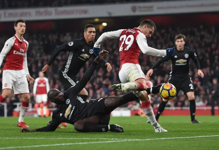 Framed Print : Xhaka vs Lukaku: Intense Shootout at Arsenal vs Manchester United (2017-18)