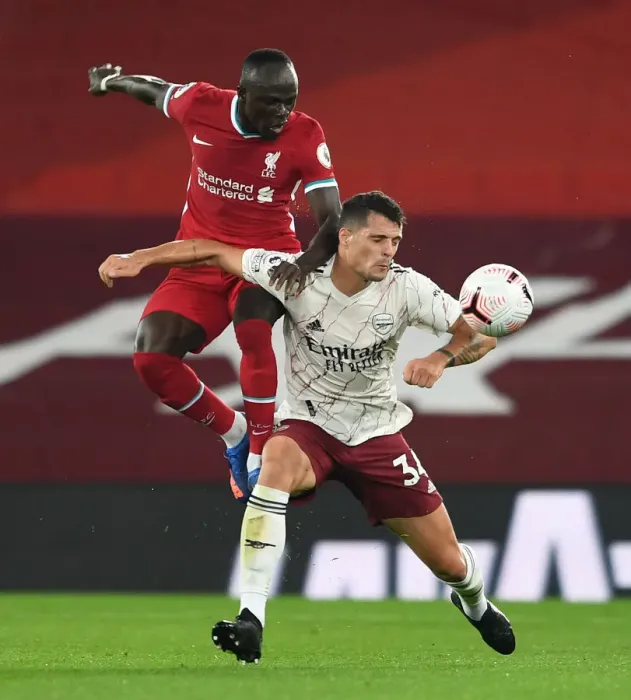 Framed Print : Xhaka vs Mane: Liverpool vs Arsenal Clash in Empty Anfield, Premier League 2020-21