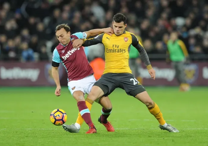Framed Print : Xhaka vs Noble: Intense Battle in West Ham United vs Arsenal Premier League Clash Framed Print : Xhaka vs Noble: Intense Battle in West Ham United vs Arsenal Premier League Clash