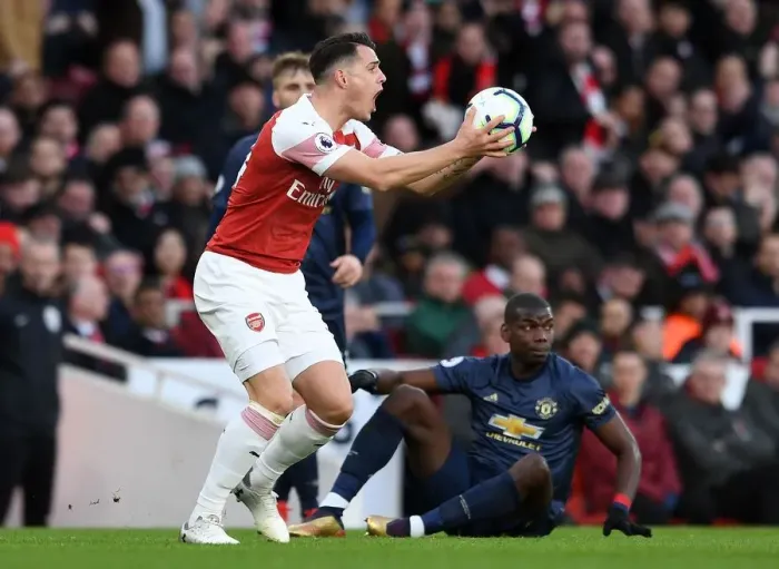 Framed Print : Xhaka vs Pogba: Intense Clash Between Arsenal's Granit Xhaka and Manchester United's Paul Pogba during the Premier League Match