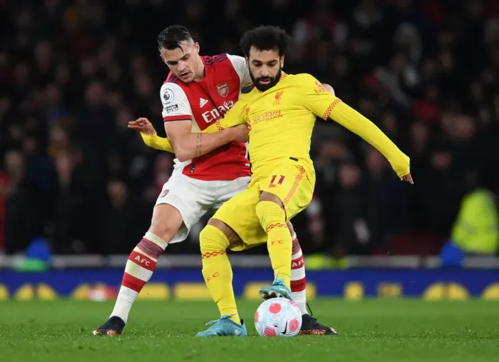 Framed Print : Xhaka vs. Salah: A Premier League Battle - Arsenal vs. Liverpool