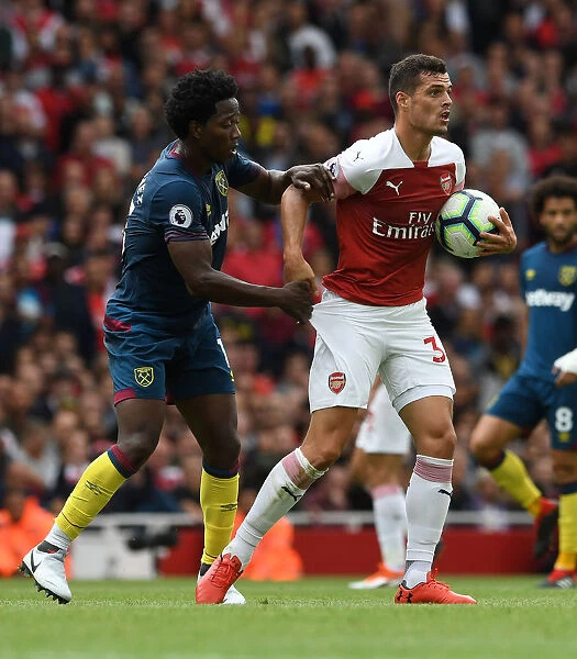 Xhaka vs Sanchez: Intense Clash Between Arsenal's Granit Xhaka and West Ham's Carlos Sanchez in the Premier League