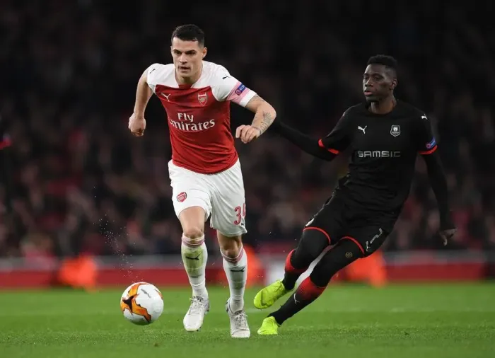 Framed Print : Xhaka vs Sarr: A Europa League Battle at Emirates Stadium