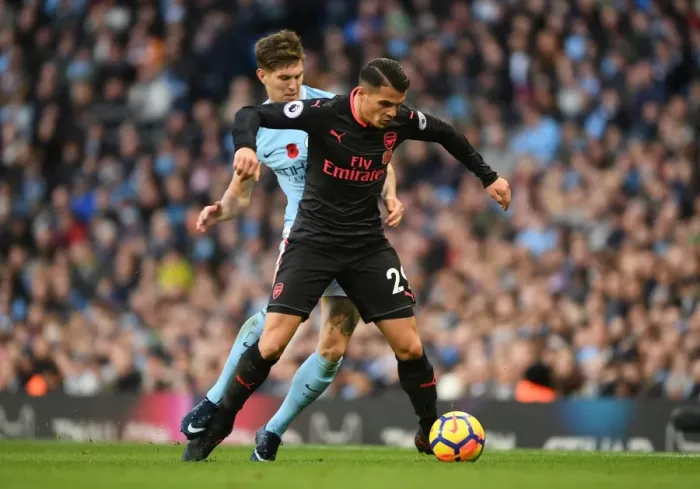 Framed Print : Xhaka vs. Stones: A Midfield Battle - Manchester City vs. Arsenal, Premier League 2017-18 Framed Print : Xhaka vs. Stones: A Midfield Battle - Manchester City vs. Arsenal, Premier League 2017-18