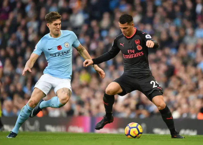 Framed Print : Xhaka vs Stones: A Midfield Showdown - Manchester City vs Arsenal, Premier League 2017-18