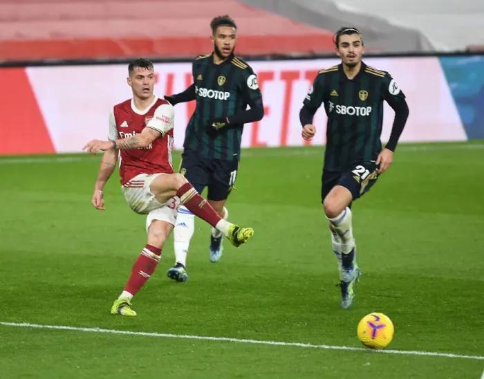 Framed Print : Xhaka vs Struijk: A Hearty Battle in the Arsenal vs Leeds United Clash
