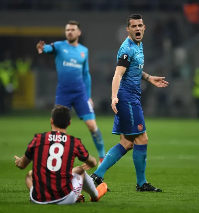 Framed Print : Xhaka vs Suso: Intense Rivalry in the UEFA Europa League Clash between AC Milan and Arsenal