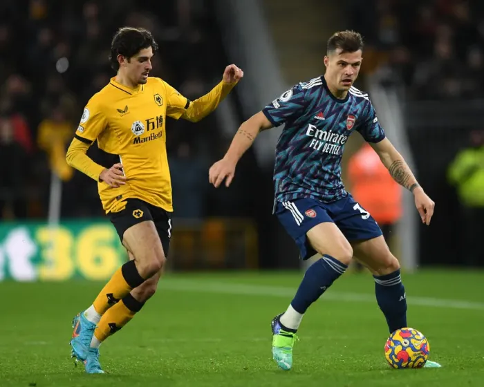 Framed Print : Xhaka vs Trincao: Intense Battle in Wolverhampton Wanderers vs Arsenal Premier League Clash Framed Print : Xhaka vs Trincao: Intense Battle in Wolverhampton Wanderers vs Arsenal Premier League Clash
