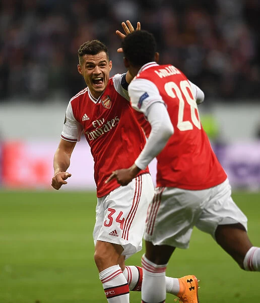Xhaka and Willock Celebrate Arsenal's Europa League Goal Against Eintracht Frankfurt