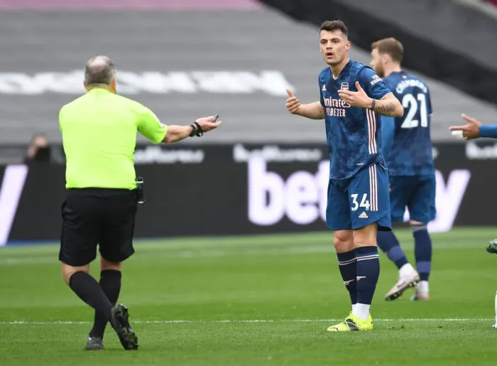 Framed Print : Xhaka's Controversial Moment: Arsenal vs. West Ham in Empty London Stadium (Premier League, March 2021)