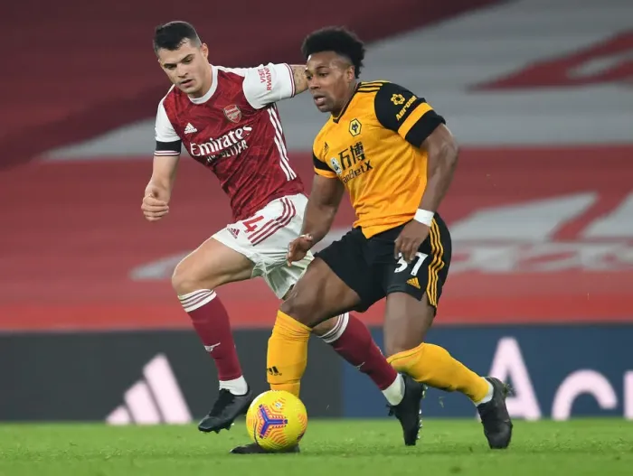 Framed Print : Xhaka's Defiant Performance: Shutting Down Traore in Empty Emirates (Arsenal vs. Wolverhampton Wanderers, Premier League 2020-21)
