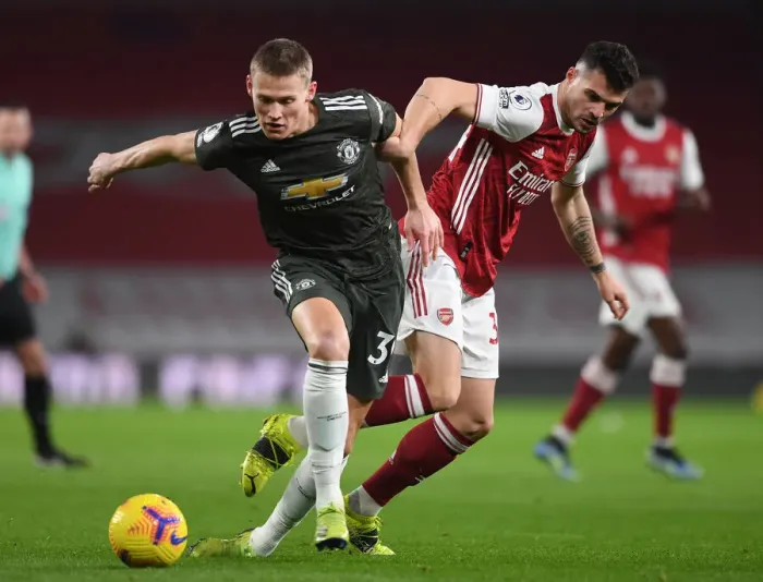 Framed Print : Xhaka's Defiant Shut-Down: Empty Emirates Silent as Arsenal Star Stifles McTominay Framed Print : Xhaka's Defiant Shut-Down: Empty Emirates Silent as Arsenal Star Stifles McTominay