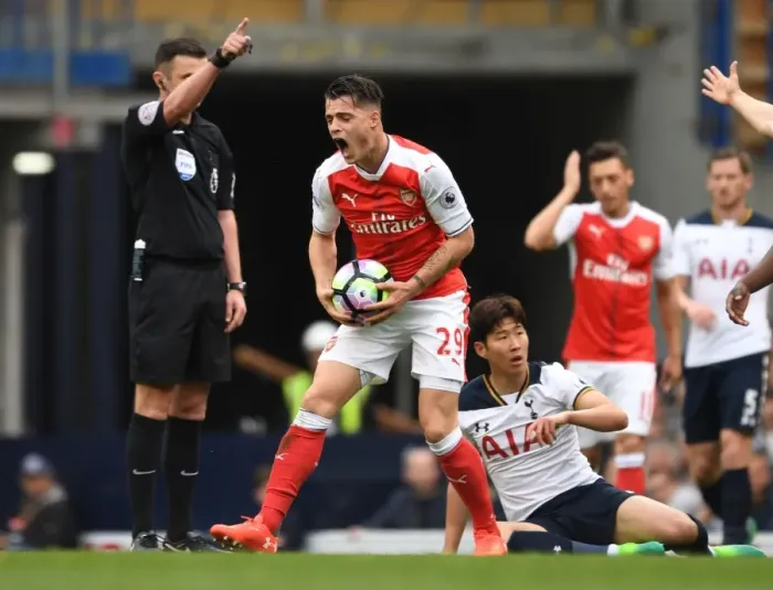 Framed Print : Xhaka's Reaction: Ref Calls Foul on Son during Tottenham vs Arsenal Clash