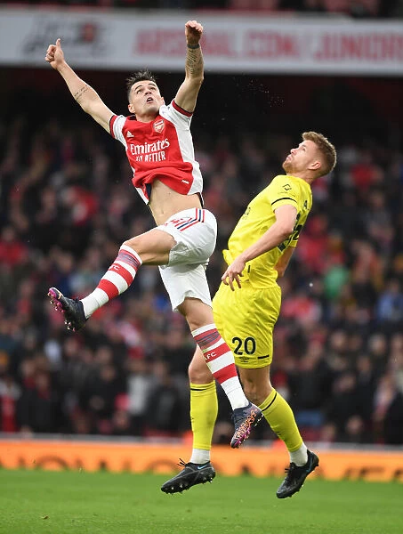 Xhaka's Supremacy: Arsenal's Midfield Marvel Outjumps Ajer in Premier League Showdown