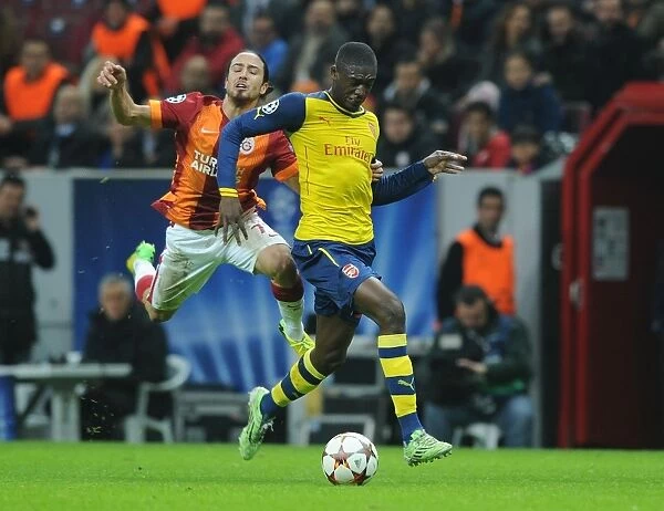 Yaya Sanogo Breaks Past Tank Camdal: Galatasaray vs. Arsenal, UEFA Champions League, Istanbul, Turkey, 2014
