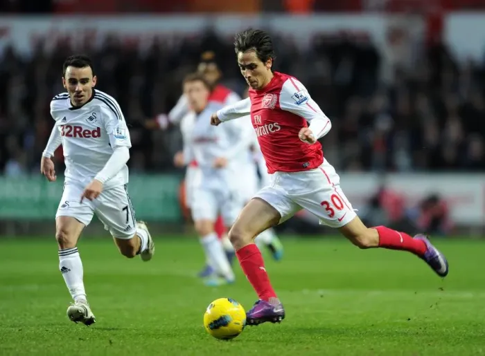 Framed Print : Yossi Benayoun (Arsenal) Leon Britton (Swansea). Swansea City 3: 2 Arsenal