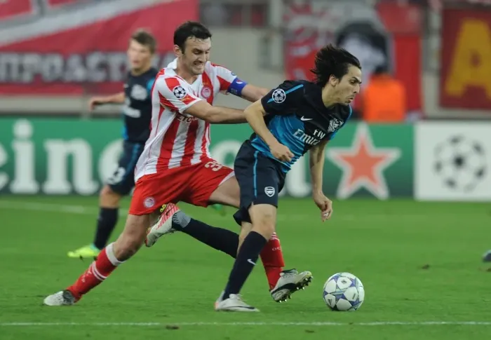 Framed Print : Yossi Benayoun vs. Vassilis Torosidis: A Battle in the UEFA Champions League between Olympiacos and Arsenal Framed Print : Yossi Benayoun vs. Vassilis Torosidis: A Battle in the UEFA Champions League between Olympiacos and Arsenal