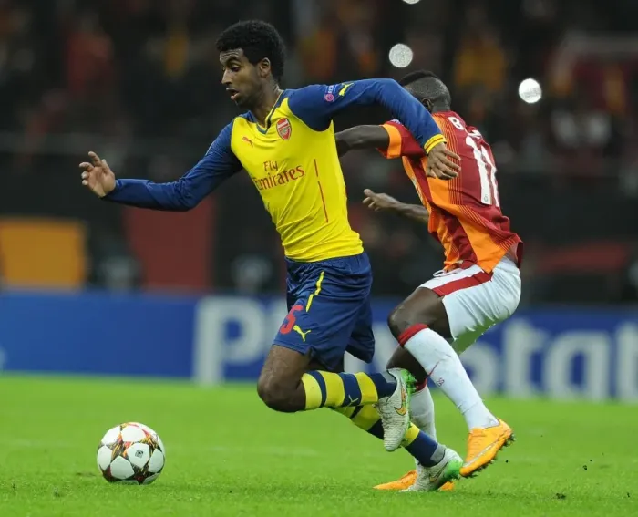 Framed Print : Zelalem Dodges Bruma: Thrilling Moment from Galatasaray vs. Arsenal UEFA Champions League Clash