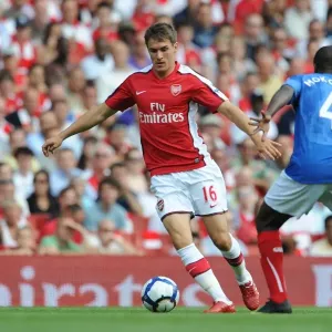 Aaron Ramsey (Arsenal) Aaron Mokoena (Portsmouth)