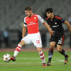 Aaron Ramsey Outmaneuvers Necip Uysal in Arsenal's UEFA Champions League Clash against Besiktas Aaron Ramsey Outmaneuvers Necip Uysal in Arsenal's UEFA Champions League Clash against Besiktas