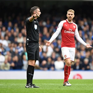 Aaron Ramsey Protests to Referee Michael Oliver during Chelsea vs Arsenal Premier League Clash